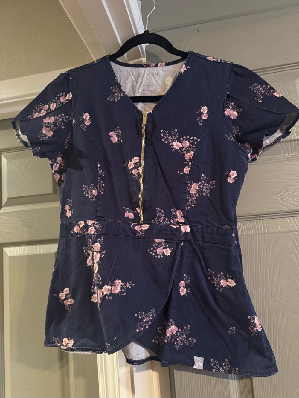 Jaanuu Navy Top with Pink Floral Print & Gold Zip